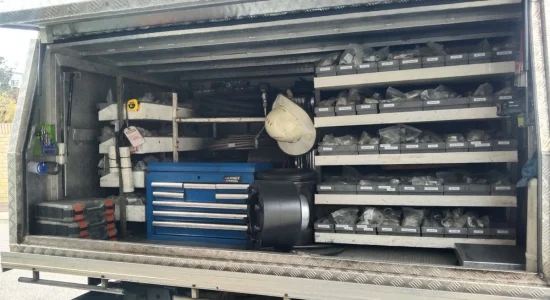 Organised service truck with tools and hard hat
